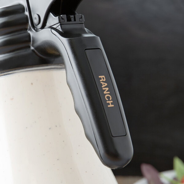 A Tablecraft black and white polypropylene dispenser tag with a black handle.