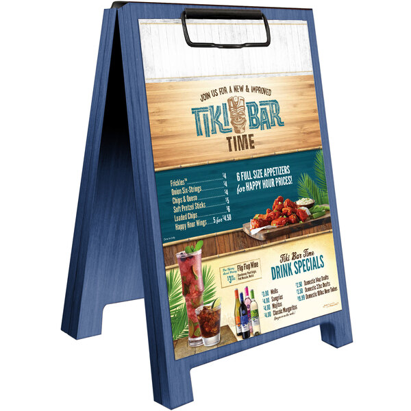 A Menu Solutions wood tent menu board on a table in a cocktail bar.
