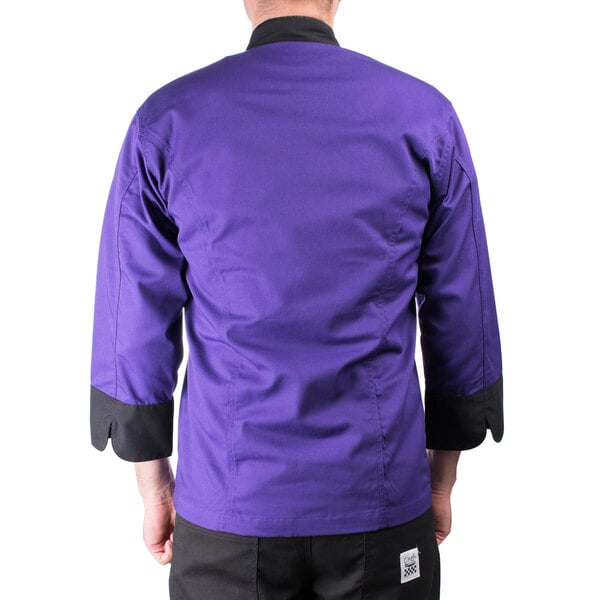 A man wearing a Mercer Culinary purple chef jacket with black accents.