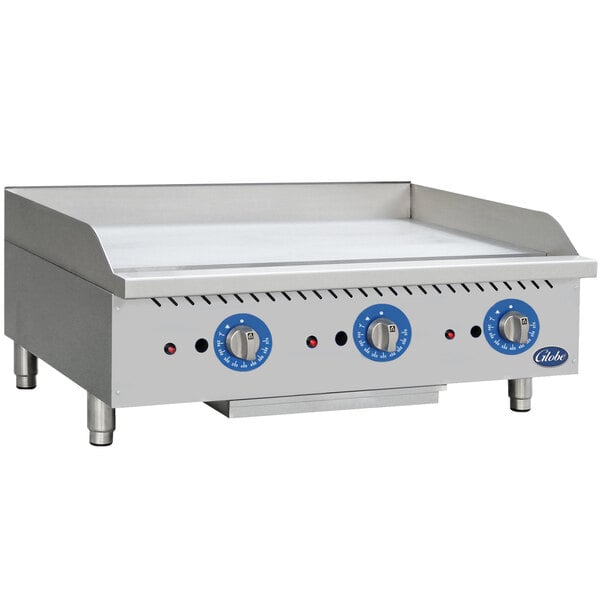 A Globe countertop gas griddle with thermostatic controls on a counter.