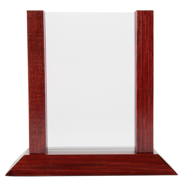 A close-up of a mahogany wood menu holder with a clear insert slot.