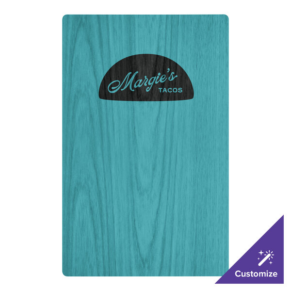 A sky blue wooden menu board with top and bottom strips and the black word "Magi's" on it.