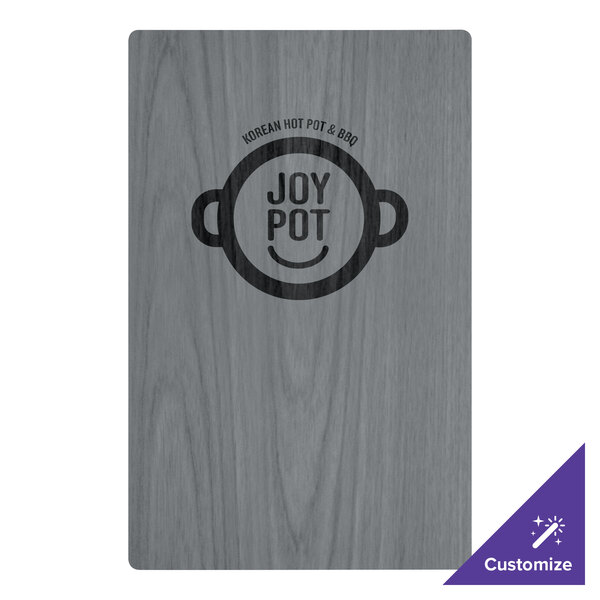 A customizable wood menu board with top and bottom strips on a table with a logo on it.