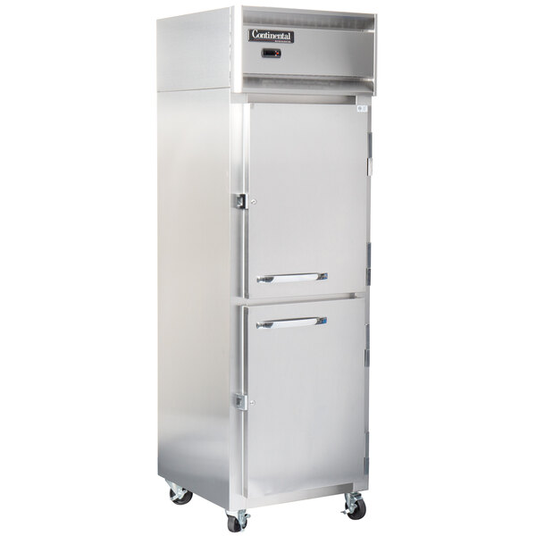 A silver Continental Reach-In Refrigerator with half doors and wheels on a white background.