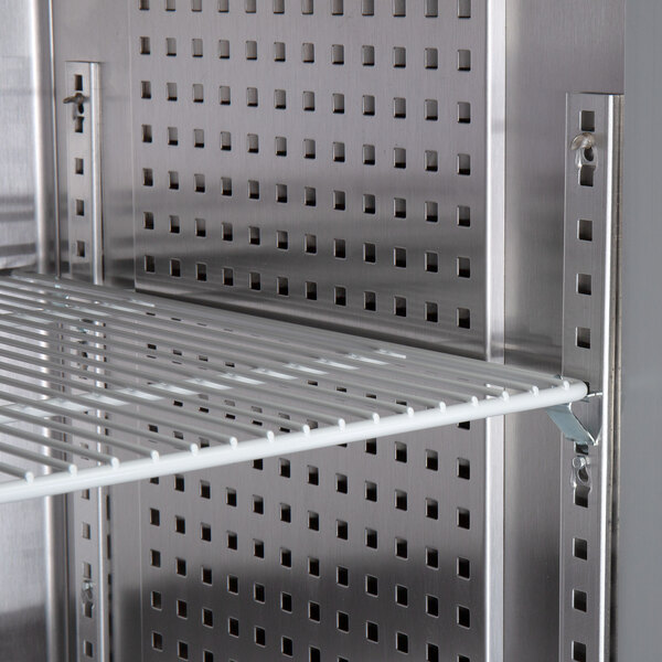 A metal grid shelf with holes for a Continental Reach-In Refrigerator.