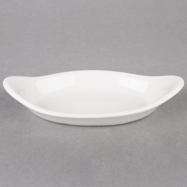 A white oval shaped Hall China rarebit dish.