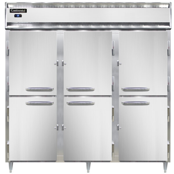 A group of three Continental reach-in refrigerators with solid half doors open.