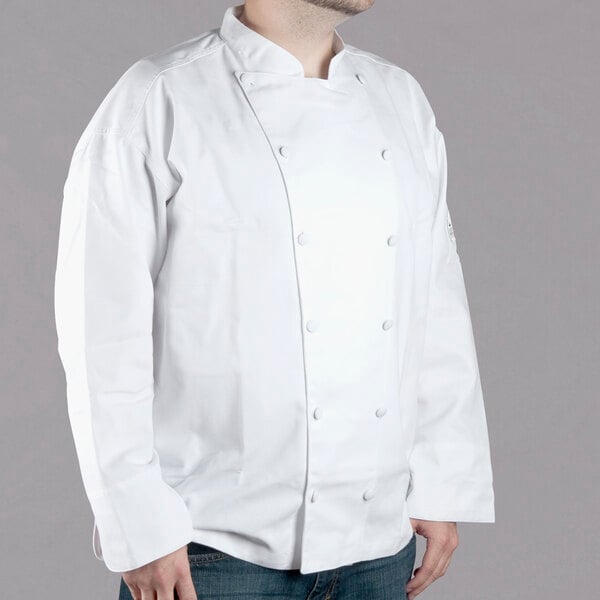 A man wearing a white Chef Revival long sleeve chef coat.