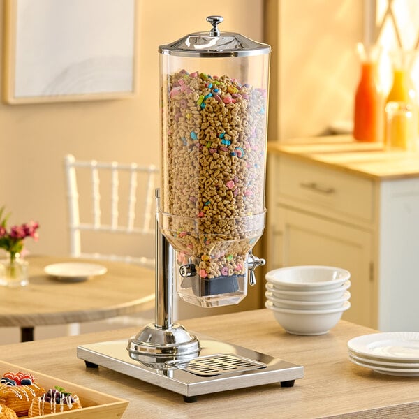 A single canister cereal dispenser with a clear container and metal base, filled with cereal.