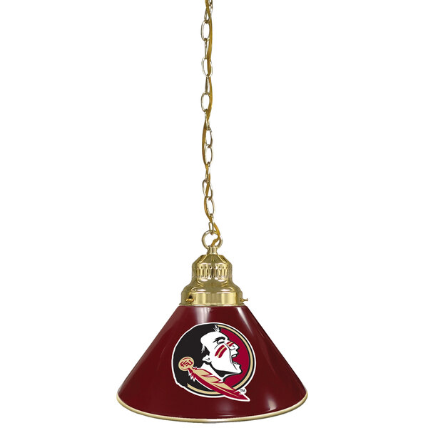 A brass pendant light with the Florida State University Seminole logo on it hanging from a chain.