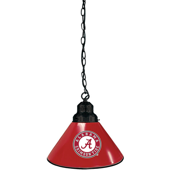 A close-up of a red Holland Bar Stool pendant light with a University of Alabama logo hanging from a chain.