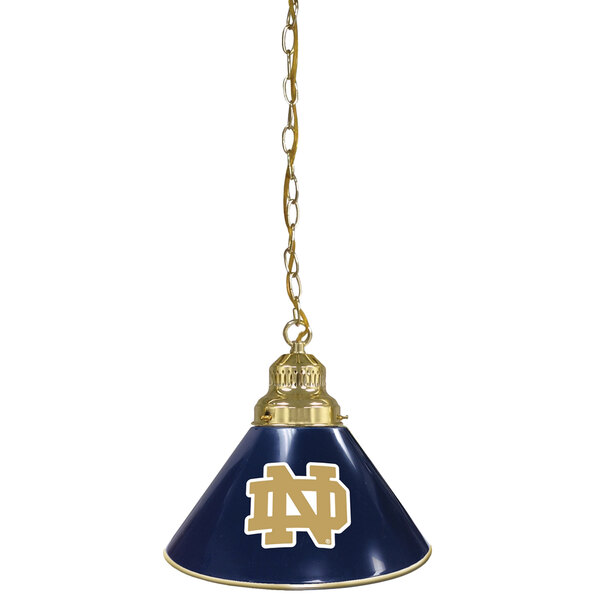 A blue pendant light with a gold University of Notre Dame logo.