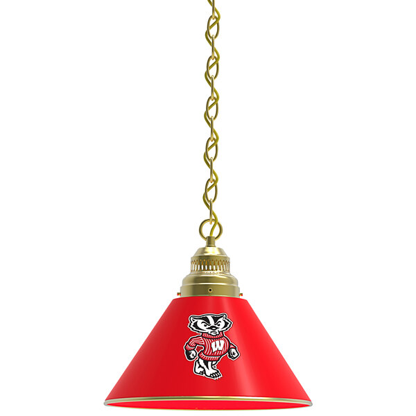 A red hanging pendant light with a brass university logo shade.