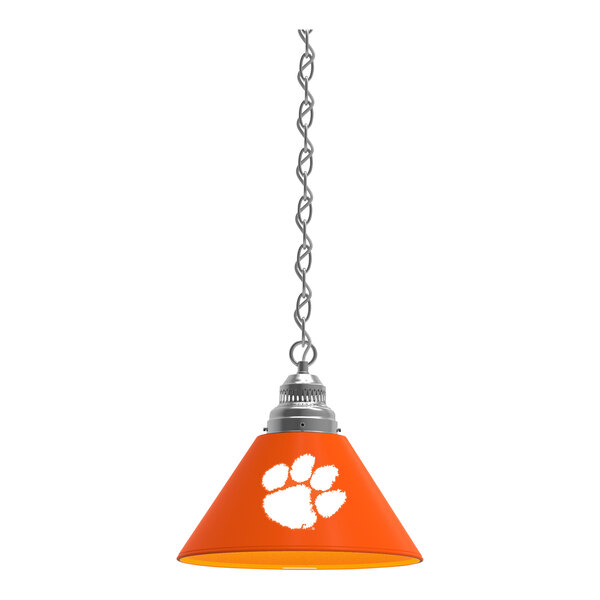 A chrome pendant light with an orange Clemson paw print.