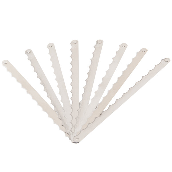 A group of silver blades with white packaging for Edlund A539L Replacement Blades for 350XL Series Electric Fruit and Vegetable Slicers.