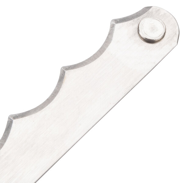 A close up of Edlund replacement blades for a fruit and vegetable slicer. The blades are silver.