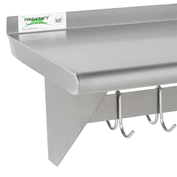 Regency 12" x 96" Stainless Steel Wall Mounted Pot Rack with Shelf and 18 Galvanized Hooks