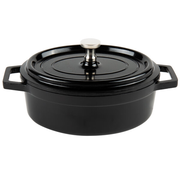 A black enamel coated cast aluminum oval pot with a lid.