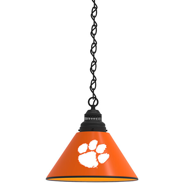 A black pendant light with an orange Clemson University paw print.