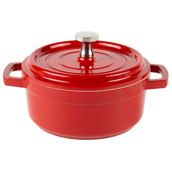 A red and white enamel coated cast aluminum round bistro pot with a lid.