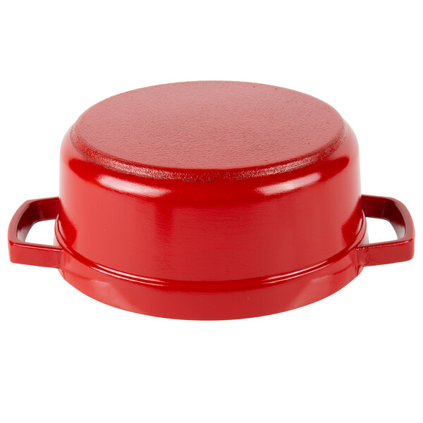 A red and white enamel coated round bistro pot with a lid.