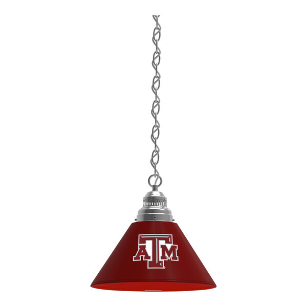 A red glass pendant light with a Texas A&M University logo in white.