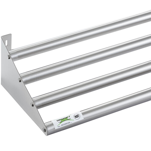A Regency stainless steel wall mounted shelf with metal rods.