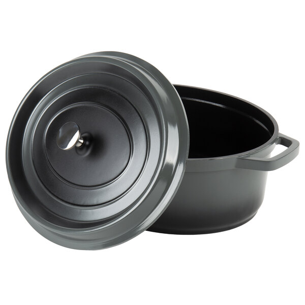 A gray enamel coated oval Dutch oven with a lid.