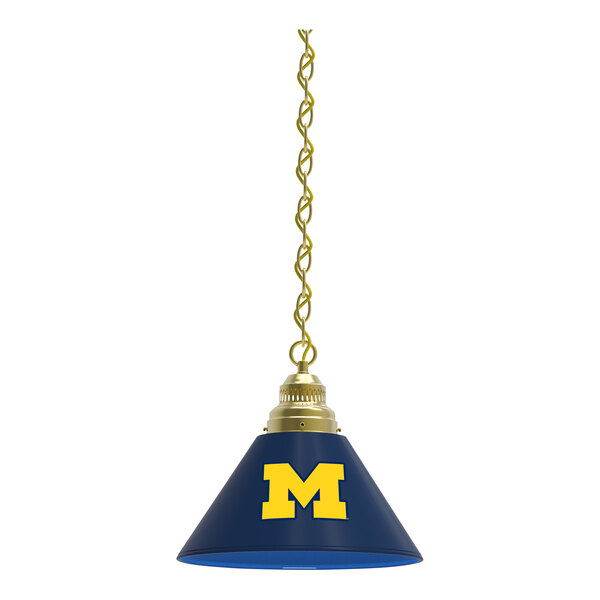 A blue lampshade with a yellow University of Michigan logo on it.