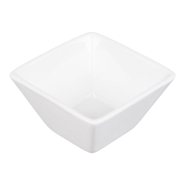 A small, white, square-shaped porcelain cup with smooth surfaces and slightly flared sides.