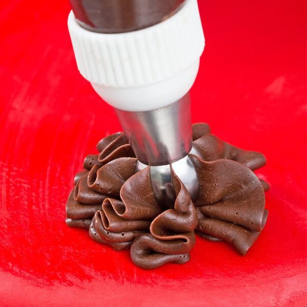 A close up of a brown pastry made with an Ateco Russian ball tip.