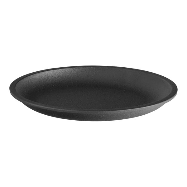 A round, black, pre-seasoned cast iron fajita skillet.
