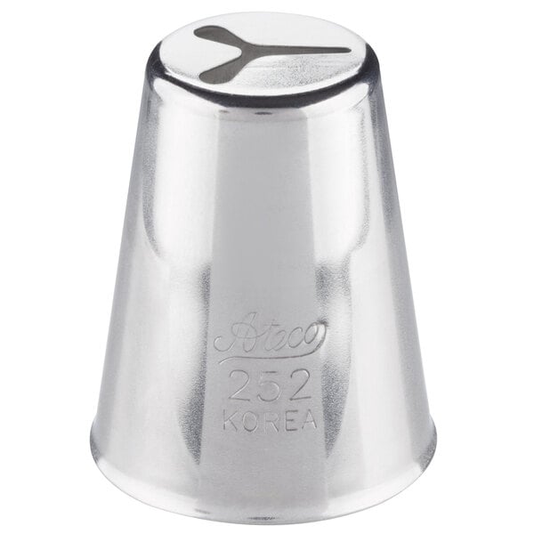 A silver metal Ateco heart piping tip with a small hole in it.