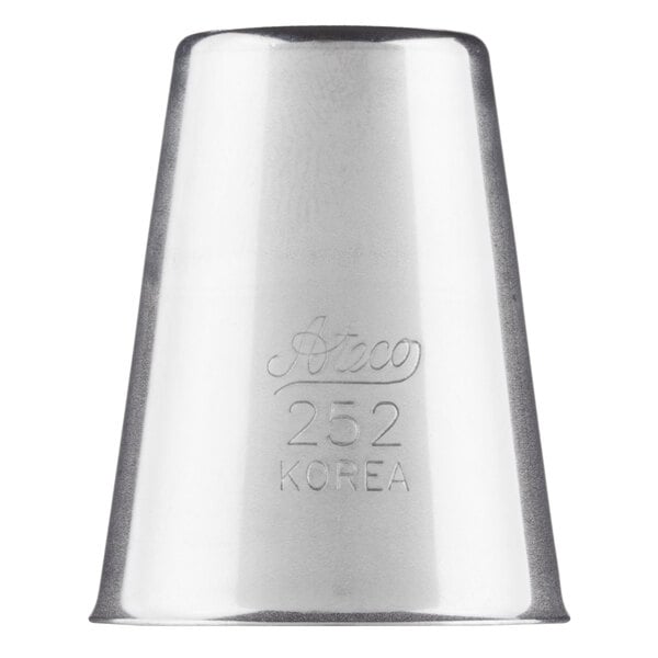 A silver metal Ateco heart piping tip with writing on it.