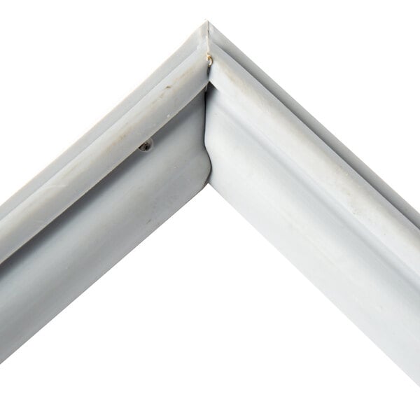 A white magnetic drawer gasket with a white metal corner.
