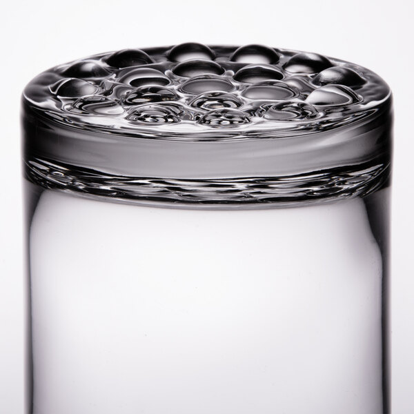 A close up of a Libbey Nob Hill Rocks Glass with bubbles in the glass.