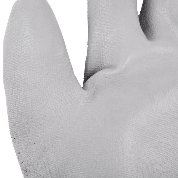 A close up of a pair of Cordova gray nylon gloves with gray polyurethane palm coating.