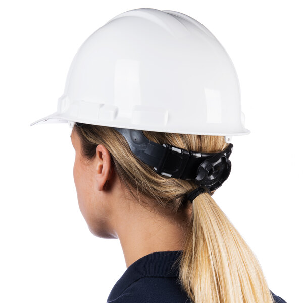 A woman wearing a white Cordova Duo Safety hard hat with a ponytail.