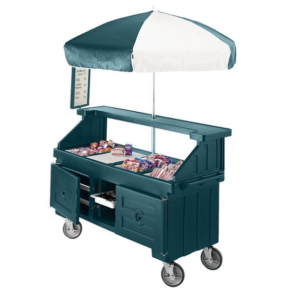 A green Cambro vending cart with umbrella and counter wells.