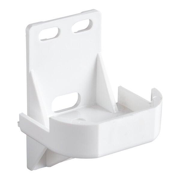 A white plastic wall-mount bracket with slots and a curved front, designed to hold a small object securely.
