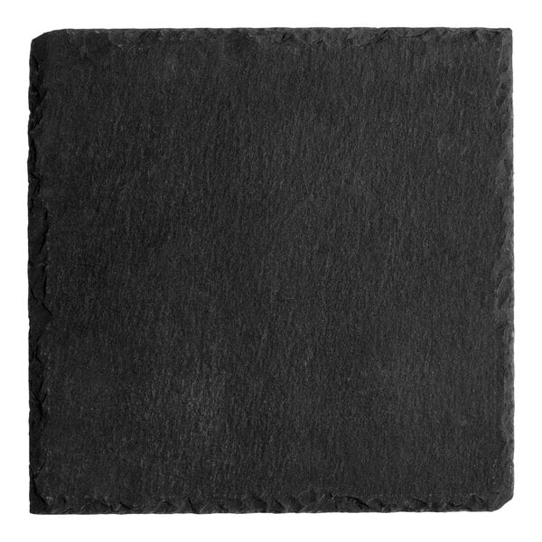 A square black slate appetizer or tasting plate.