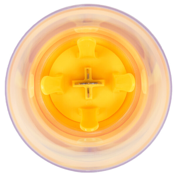 A close up of a yellow Weston corn stripper with a hole in the middle.