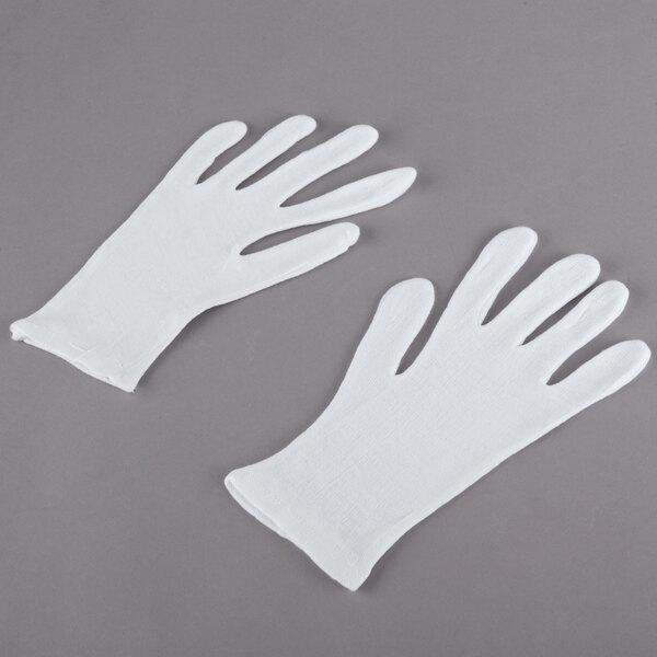 A pair of white Cordova medium weight reversible gloves.