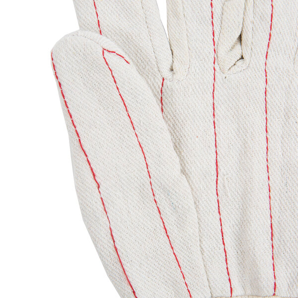 A close up of a Cordova double palm work glove with red stitching.