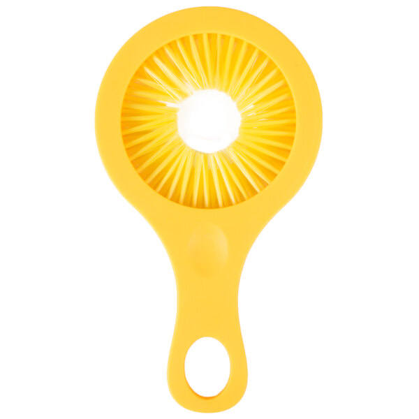 A yellow plastic oval-shaped object with a circle in the center.