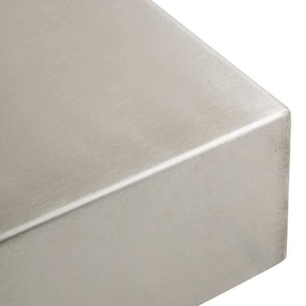 A Tablecraft stainless steel rectangular bowl on a table.