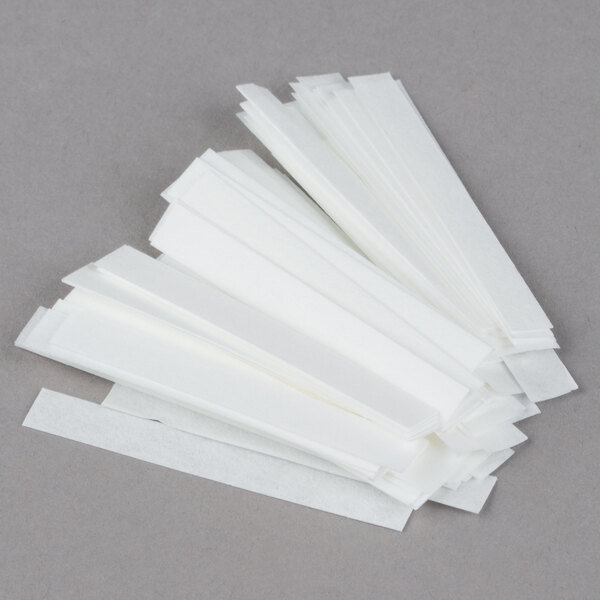 A group of white FMP chlorine sanitizer test strips.