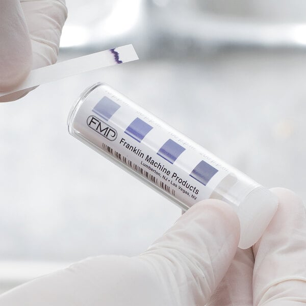 a person holding a test tube