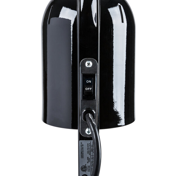 A black Nemco freestanding heat lamp with a cord.