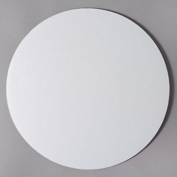 A 14" white corrugated cake circle.